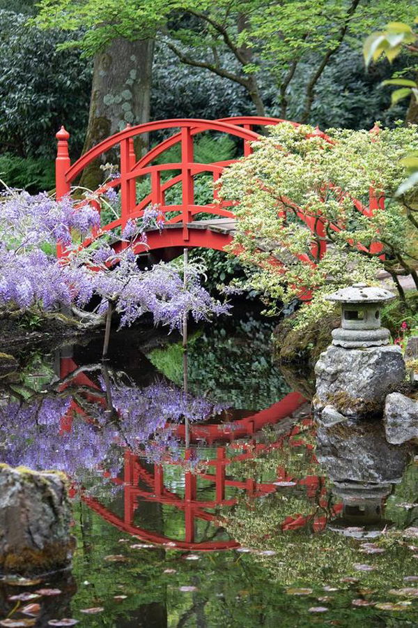 red-japanese-bridge-in-zen-garden