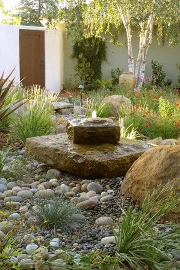 stone-fountain-concept-with-gravel-garden