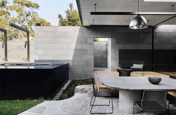outdoor-concrete-dining-space-with-pool