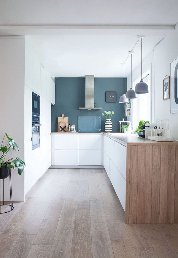 minimalist-white-kitchen-with-blue-wall-accent
