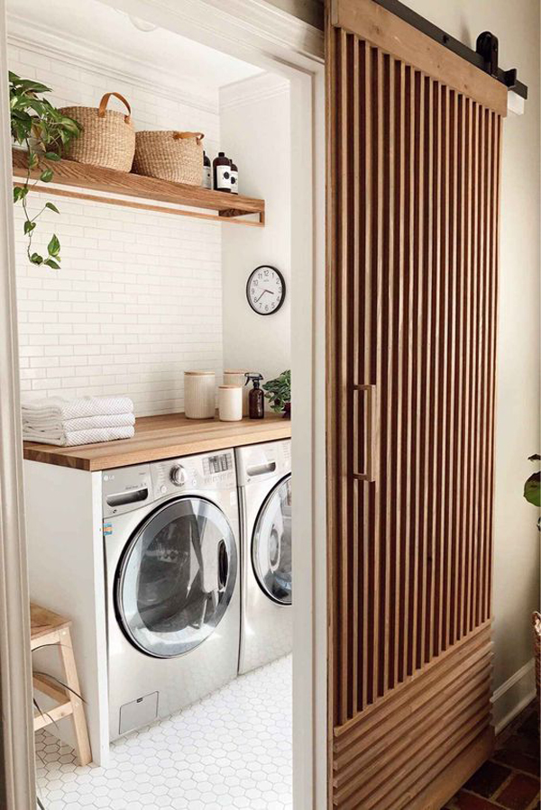 small-laundry-room-with-wood-sliding-door