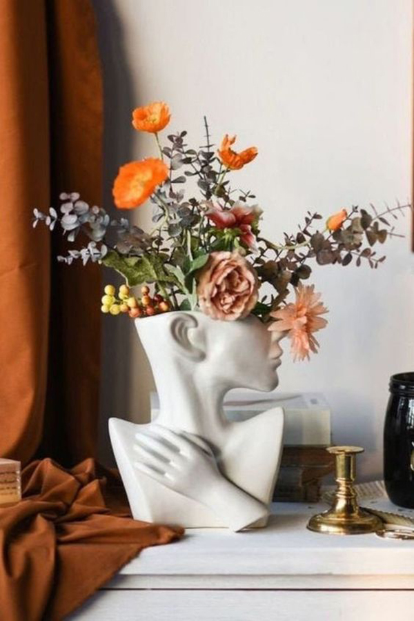 statue-flower-vase-face