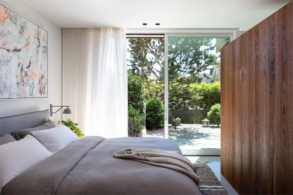 open-and-airy-bedroom-design-with-glass-sliding-door