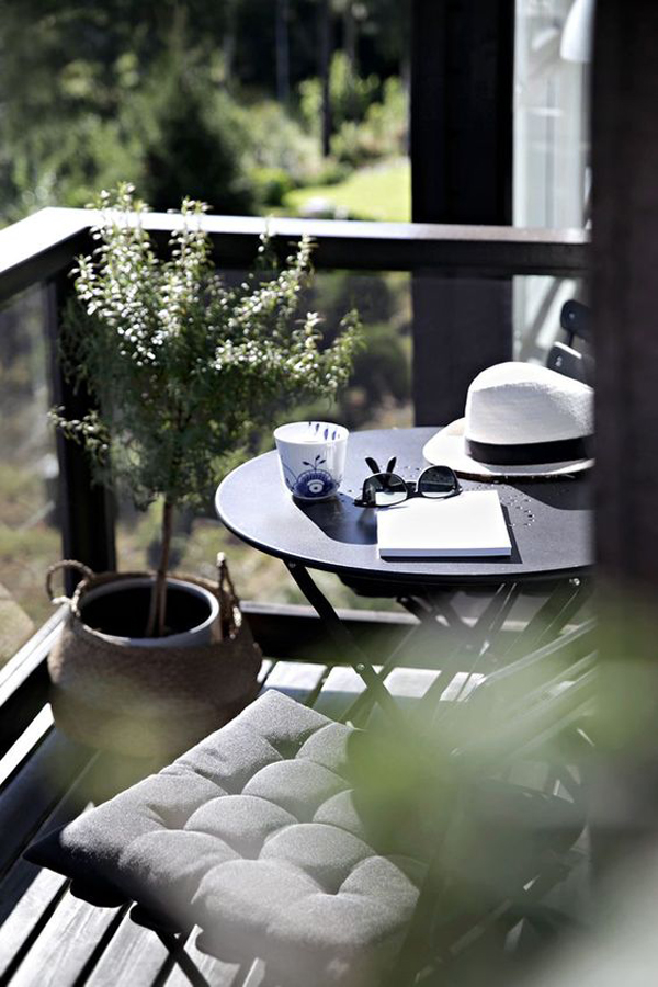 black-tiny-balcony-design-with-round-coffee-table