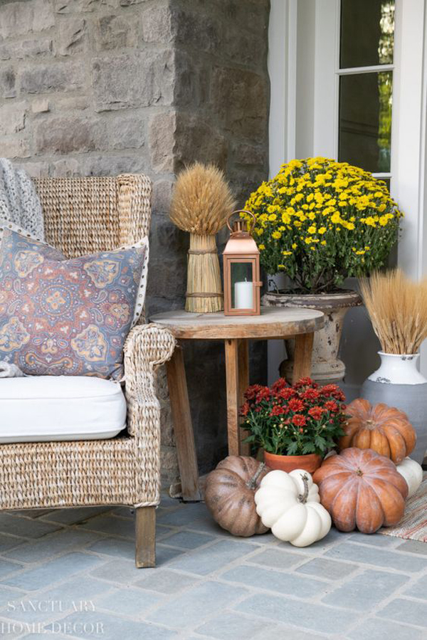 cozy-fall-front-porches-with-piles-of-pumpkins-and-flowers
