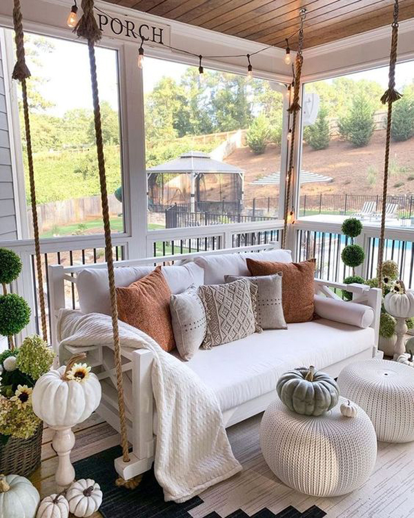 small-fall-porch-with-rope-swing-and-pillow