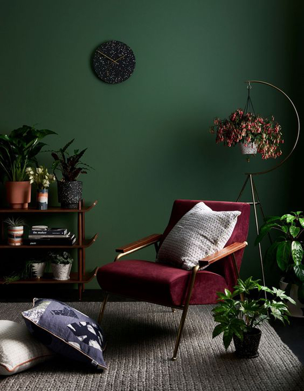 cozy-reading-nook-with-green-paint-color-and-indoor-plants