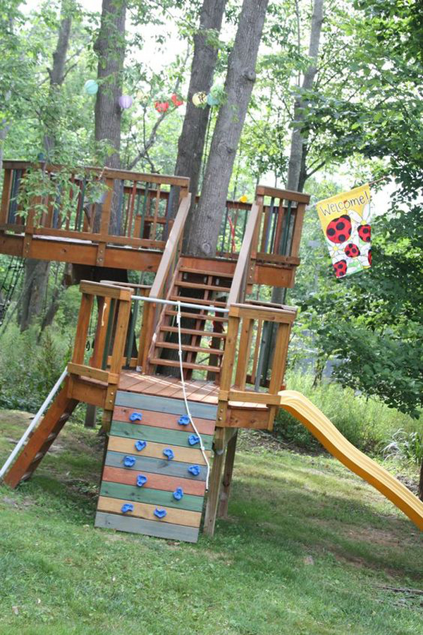 kids-backyard-treehouse-with-climbing-wall