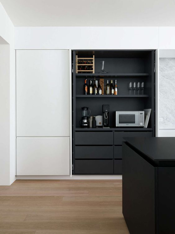 minimalist-hidden-kitchen-with-black-and-white-color