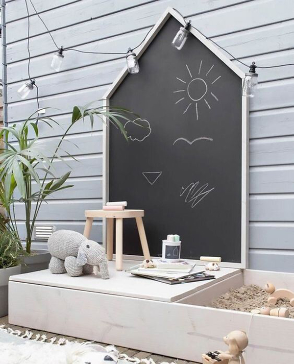 backyard-kid-play-area-with-chalkboard-and-sandbox