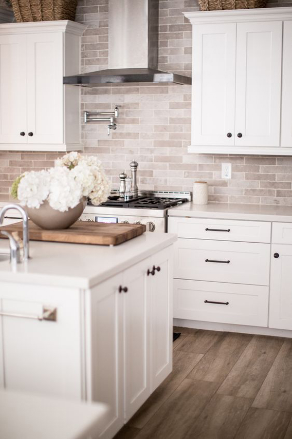 white-kitchen-cabinet-with-brick-backsplashes