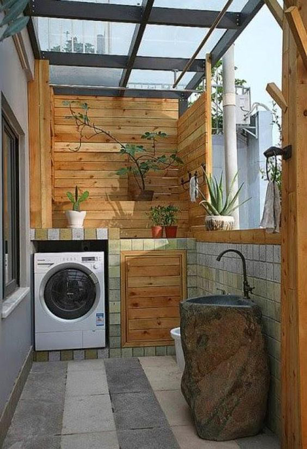 indoor-outdoor-laundry-room-with-plant-and-wood-accent