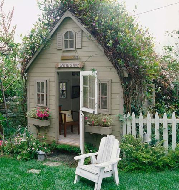 tiny-cottage-garden-shed-with-plant-roof