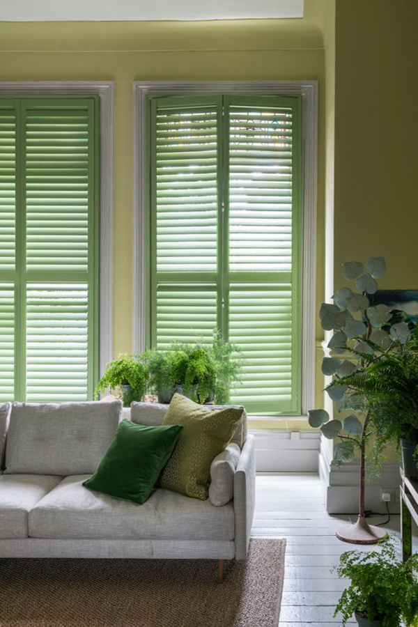 natural-living-room-with-green-window-shutters