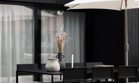 modern-black-house-exterior-with-dining-area