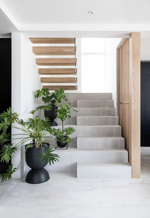concrete-staircase-design-with-houseplant-display