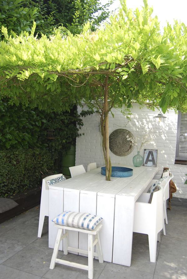 white-table-and-dining-area-around-trees