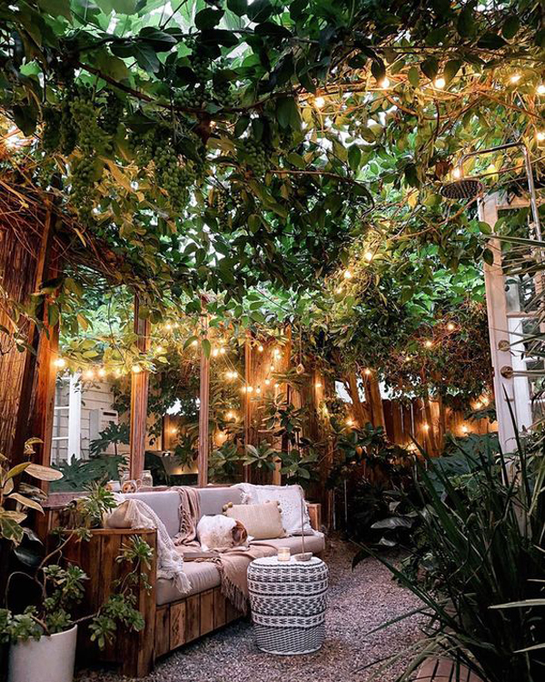 cozy-tropical-backyard-seating-with-string-light