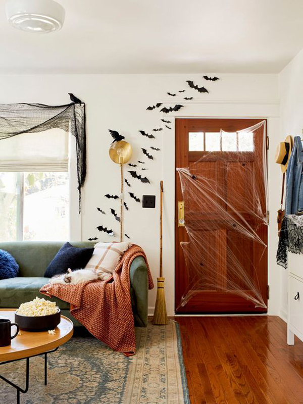 halloween-living-room-design-with-spiderweb-door-and-bat-wall